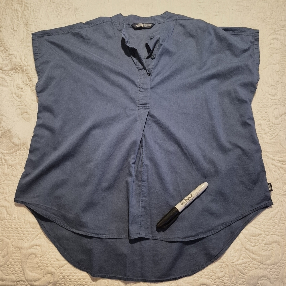 North Face women's Medium blue sleeveless shirt, has 1 mark on front